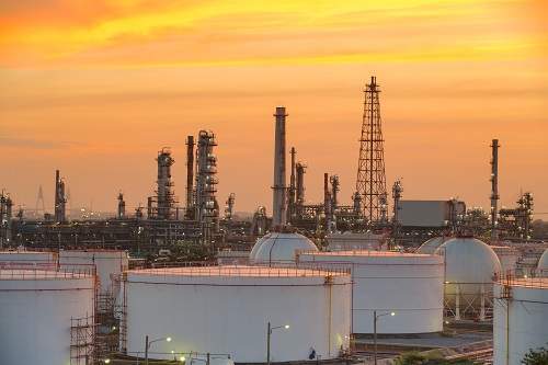 industry Oil refinery and oil thank in sunset background