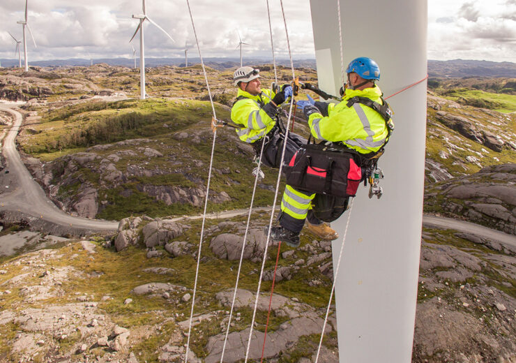 wind-turbines-workers-hanging-yellow-vest